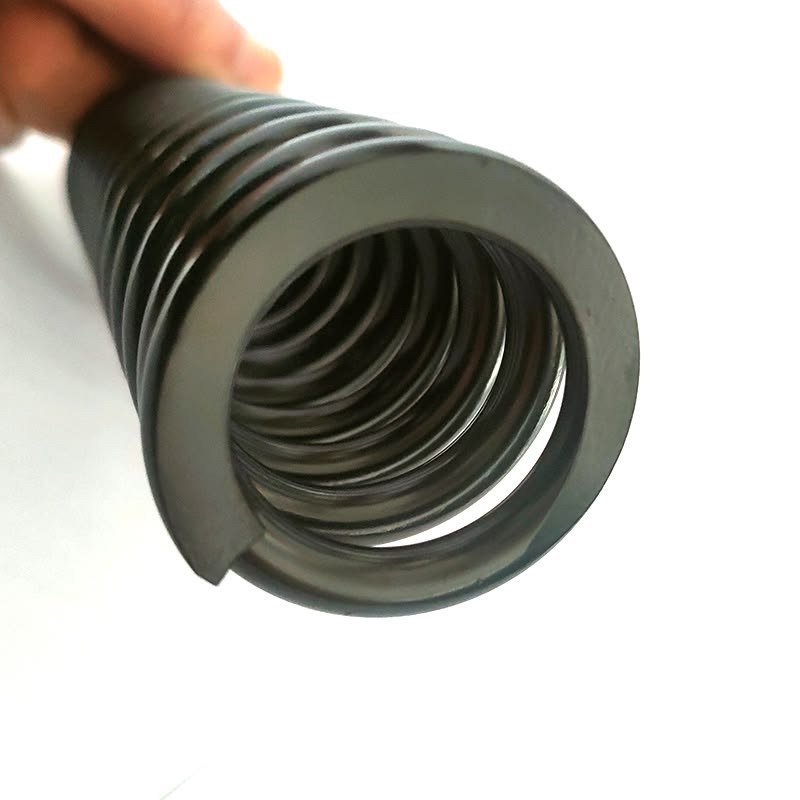 Coil spring, hand-held for scale